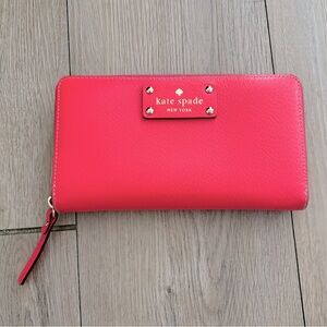 Kate Spade bright pink full-size wristlet wallet